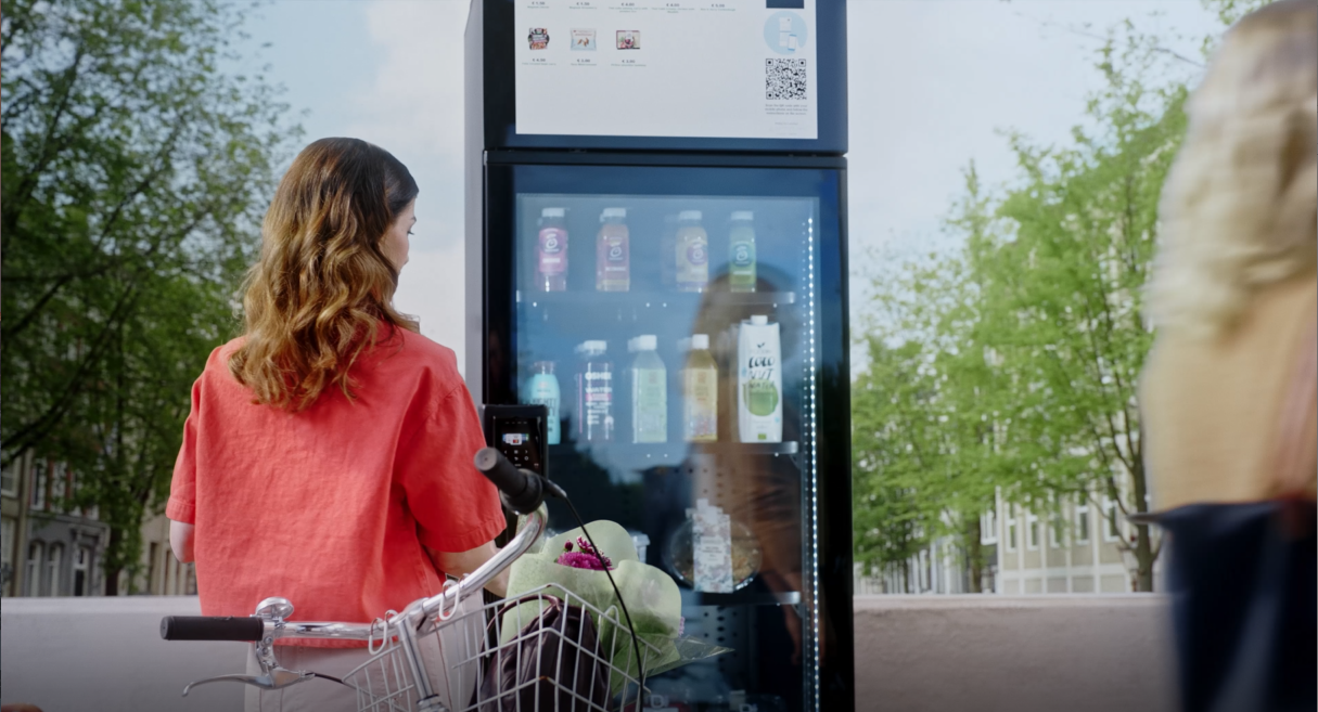 A person buying from a smart vending machine